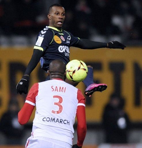 Reims' forward Odair Fortes (L) clashes with Nancy's defender Joel Sami on February 9, 2013 in Tomblaine